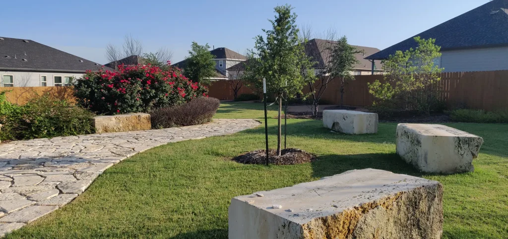 Concrete benches and path on Kezar Green park terrace.