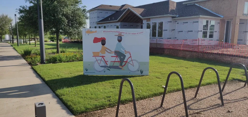 Another sign with two illustrated people riding a bike